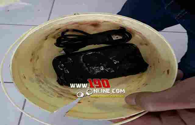 Esposa de preso é detida ao tentar entrar em cadeia com celular escondido em marmita de feijão