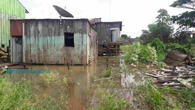 MADEIRA CONTINUA SUBINDO E DEFESA CIVIL DIZ QUE MORADORES RESISTEM PARA SAIR DAS CASAS ALAGADAS